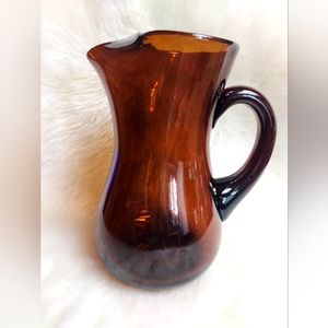 Dark Amber Hand blown glass pitcher with ice lip.